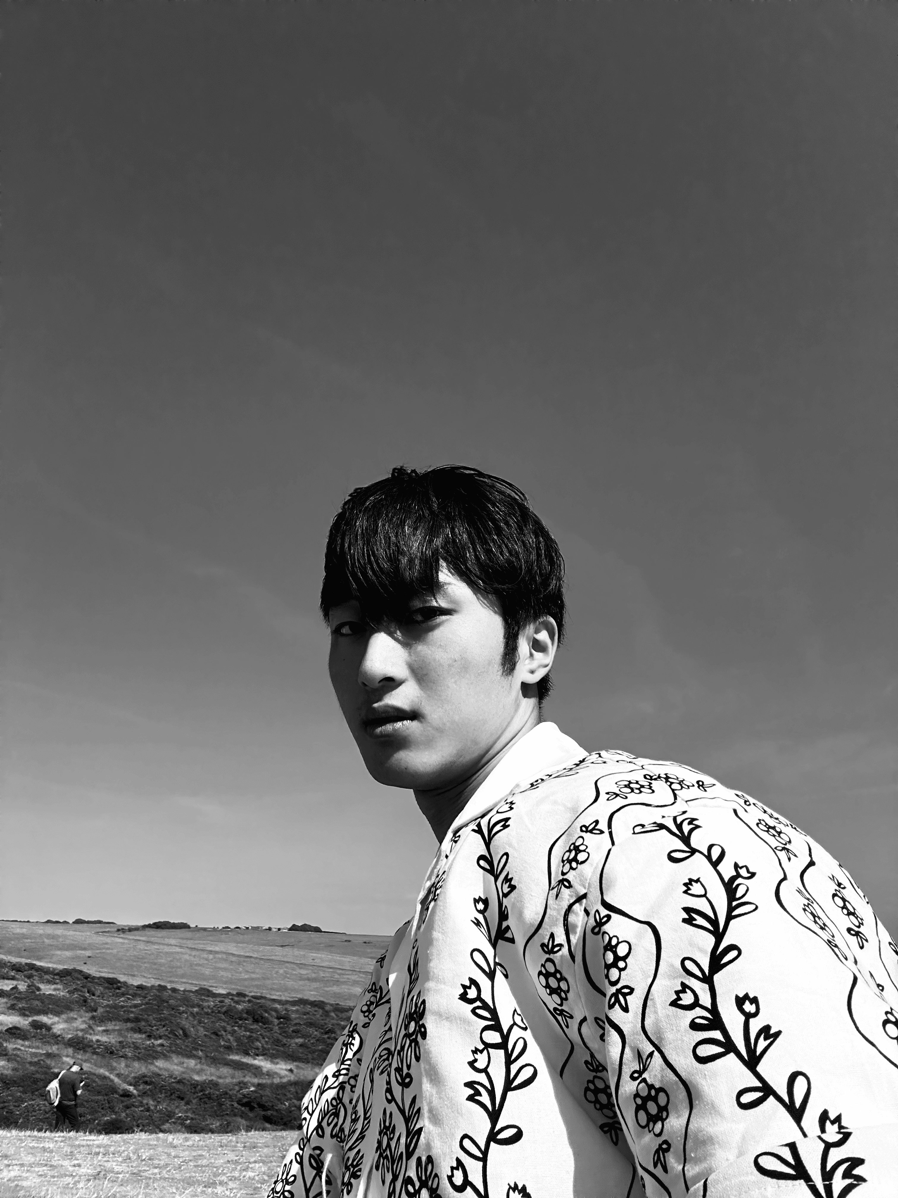 Black-and-white portrait of Kio Wang